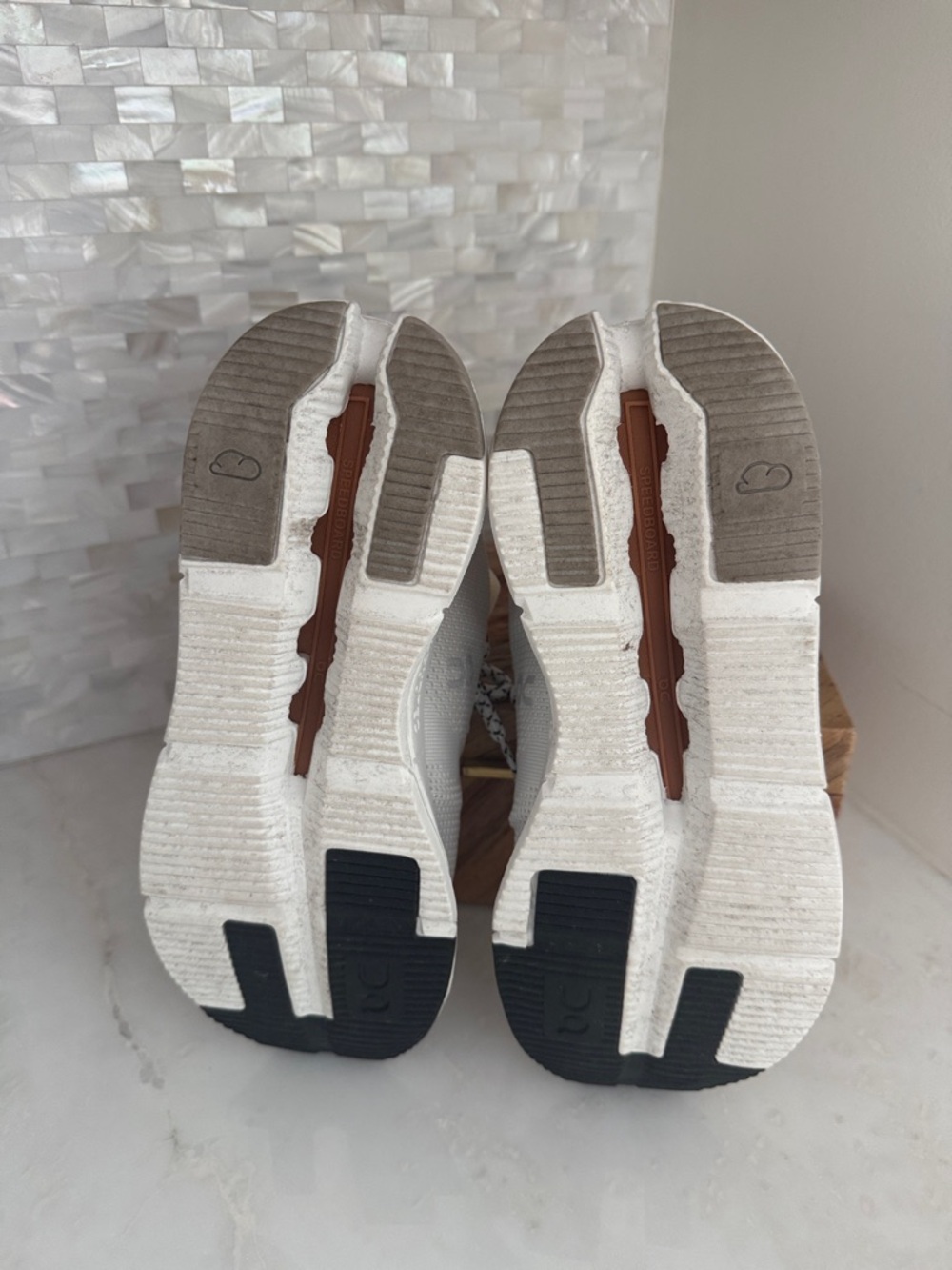On Cloud Women’s Athletic Shoes in White with Tan Accents - Picture 5 of 6